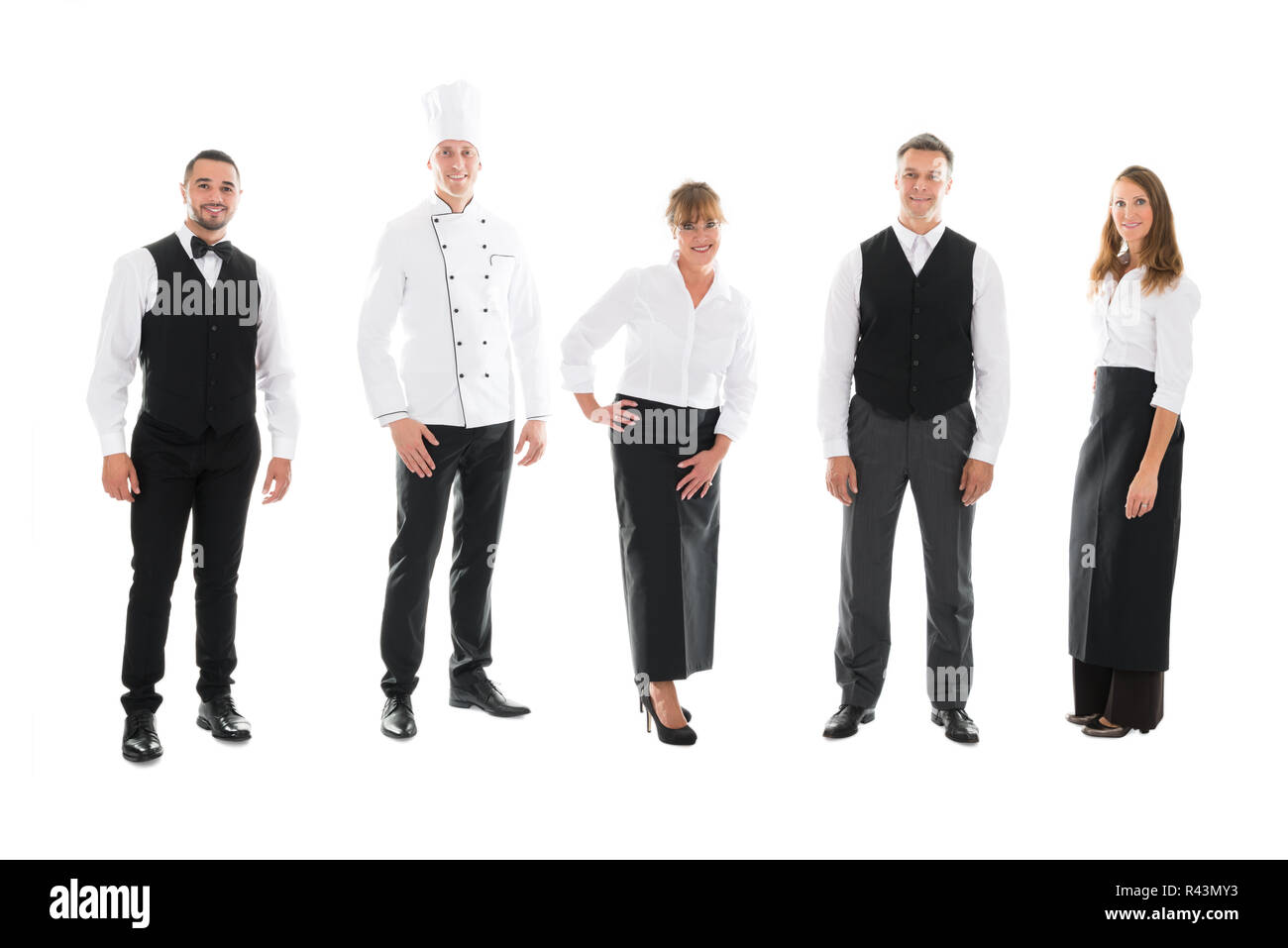 Happy Restaurant Staff Standing Over White Background Stock Photo