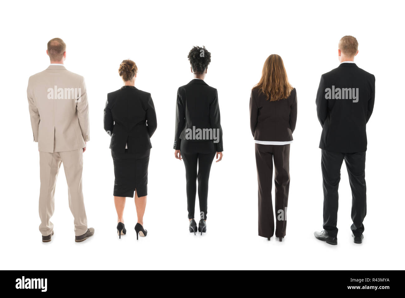 Business Team Standing Against White Background Stock Photo