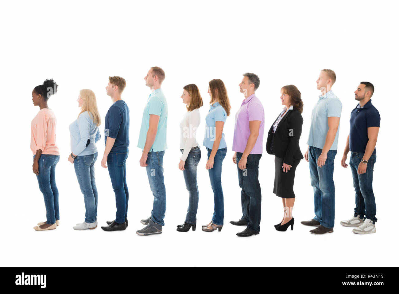 Side View Of Creative Business People Standing In Row Stock Photo