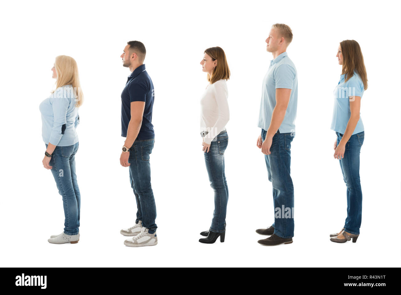 Side View Of People Standing In Queue Stock Photo