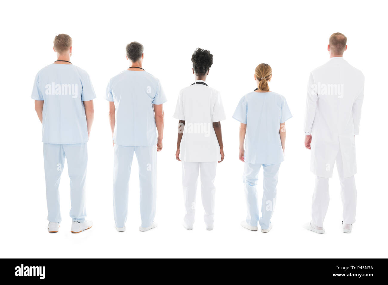 Medical Team Standing Against White Background Stock Photo