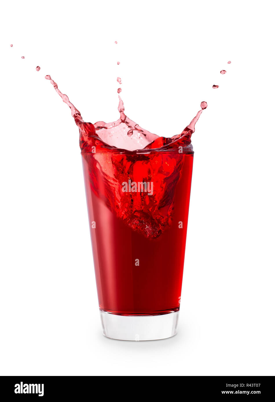red juice or berry compote with splashes in glass isolated on white