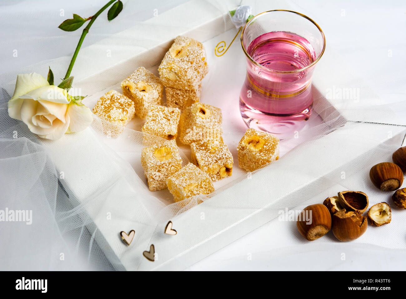 Turkish delight dessert with hazelnut and rose tea top view Stock Photo