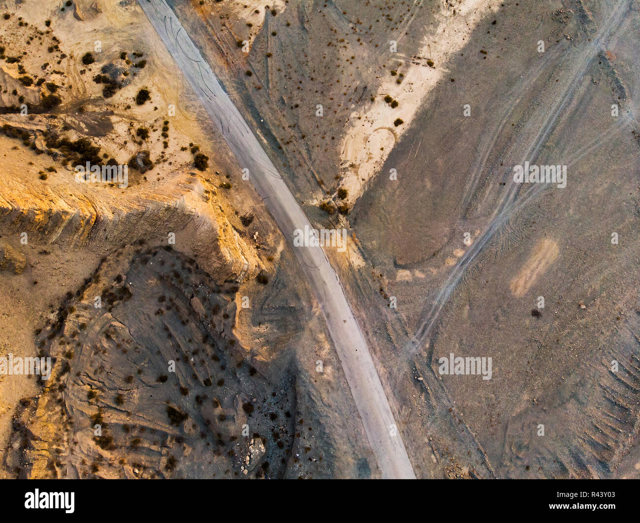 Aerial view of a desert road with rocky scenery Stock Photo