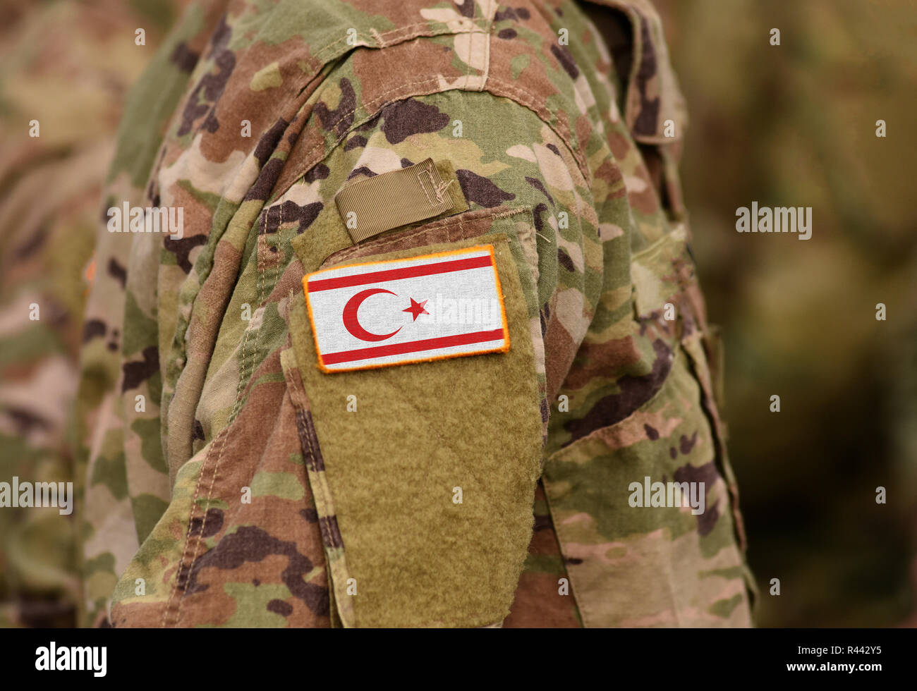 Northern Cyprus flag on soldiers arm (collage). Stock Photo