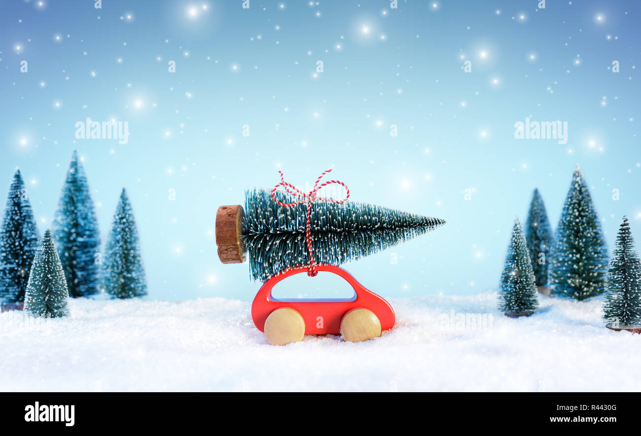 Incoming Cristmas Concept - Car Carrying A Christmas Tree In Snowy ...
