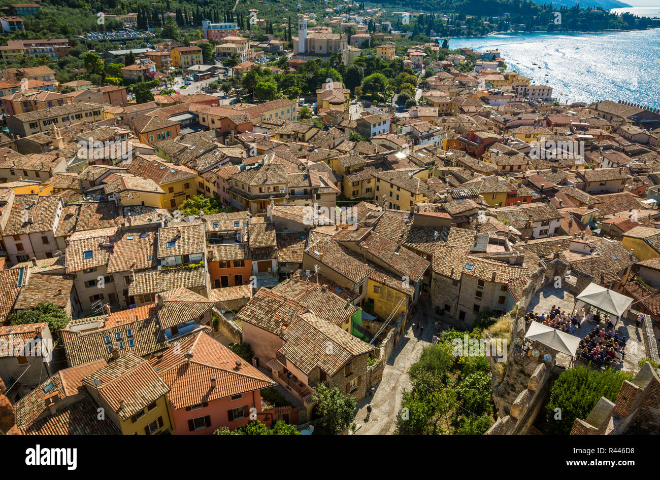 View over Lake Garda over the tiled roofs of Malcesine, Lake Garda, Italy, Veneto region of Italy. Aerial view, top view Stock Photo