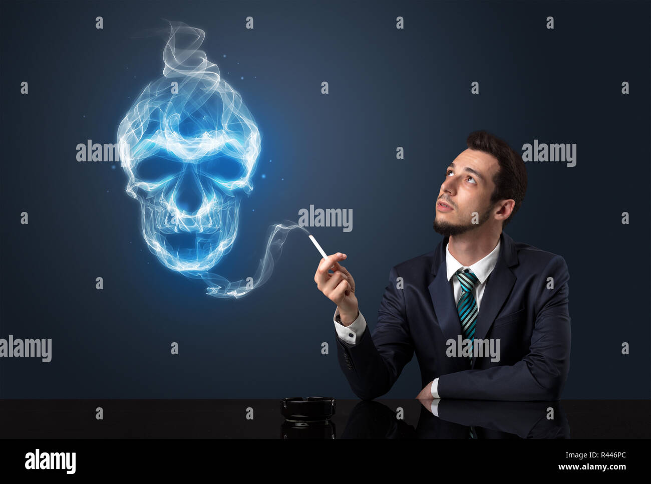 Businessman smoking with skull simbol above his head. Stock Photo