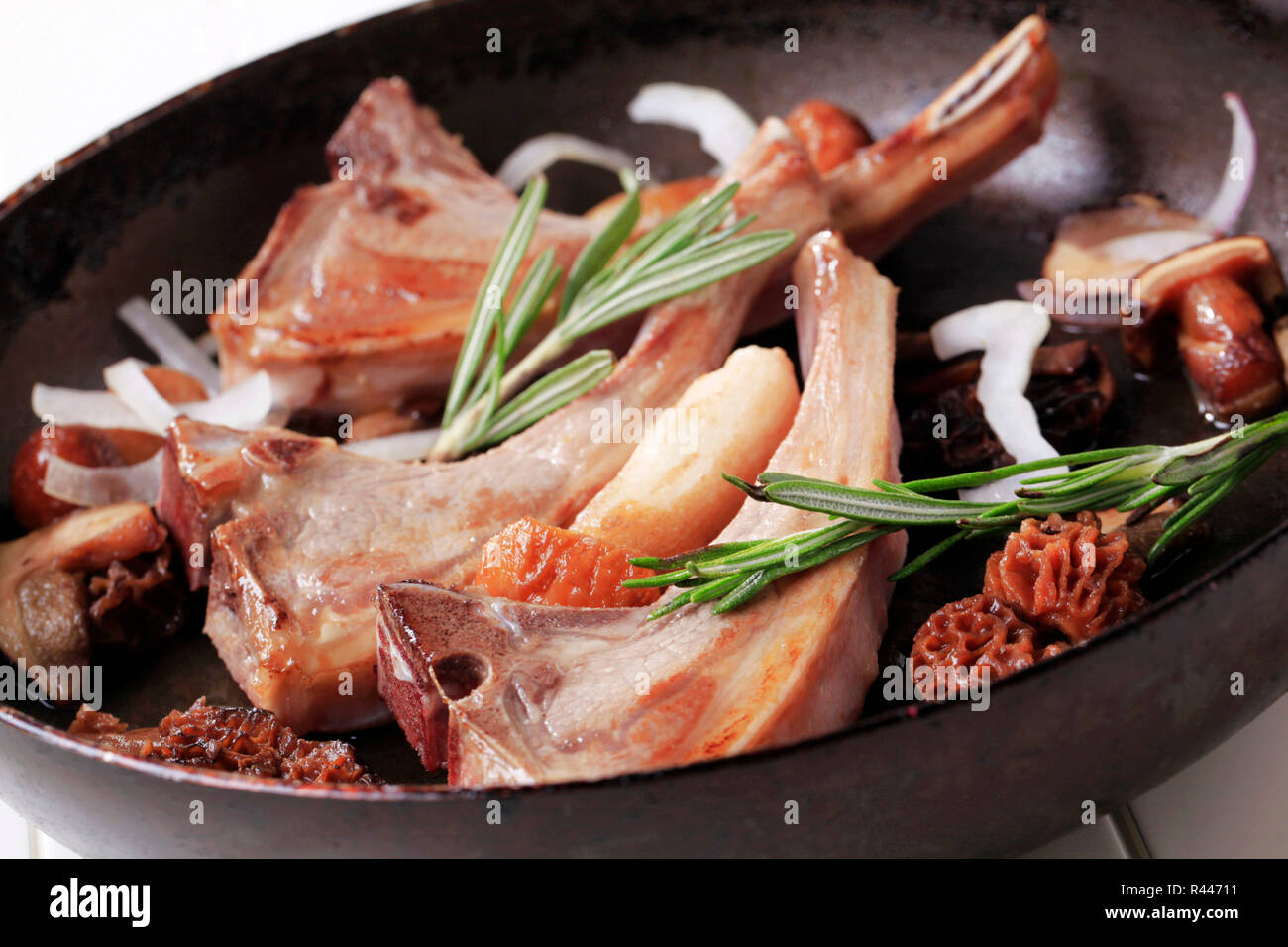 Pan-roasted lamb chops and mushrooms Stock Photo - Alamy