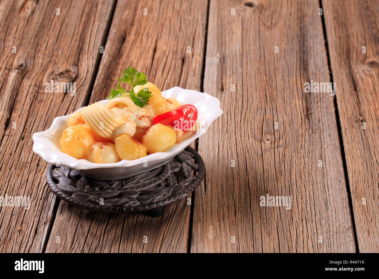 Potatoes with mozzarella cheese Stock Photo - Alamy