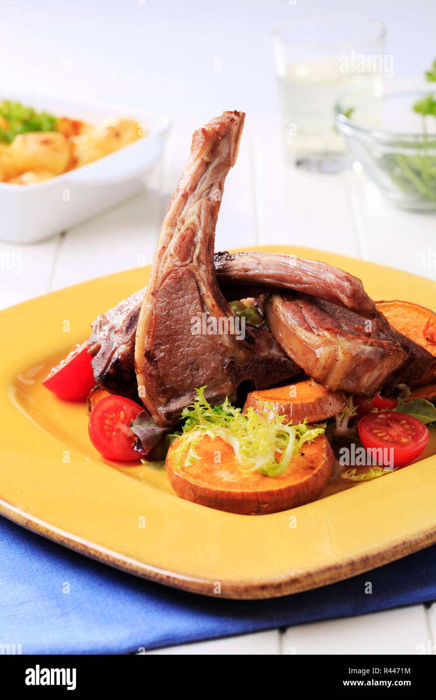 Roast lamb chops with sweet potatoes Stock Photo - Alamy