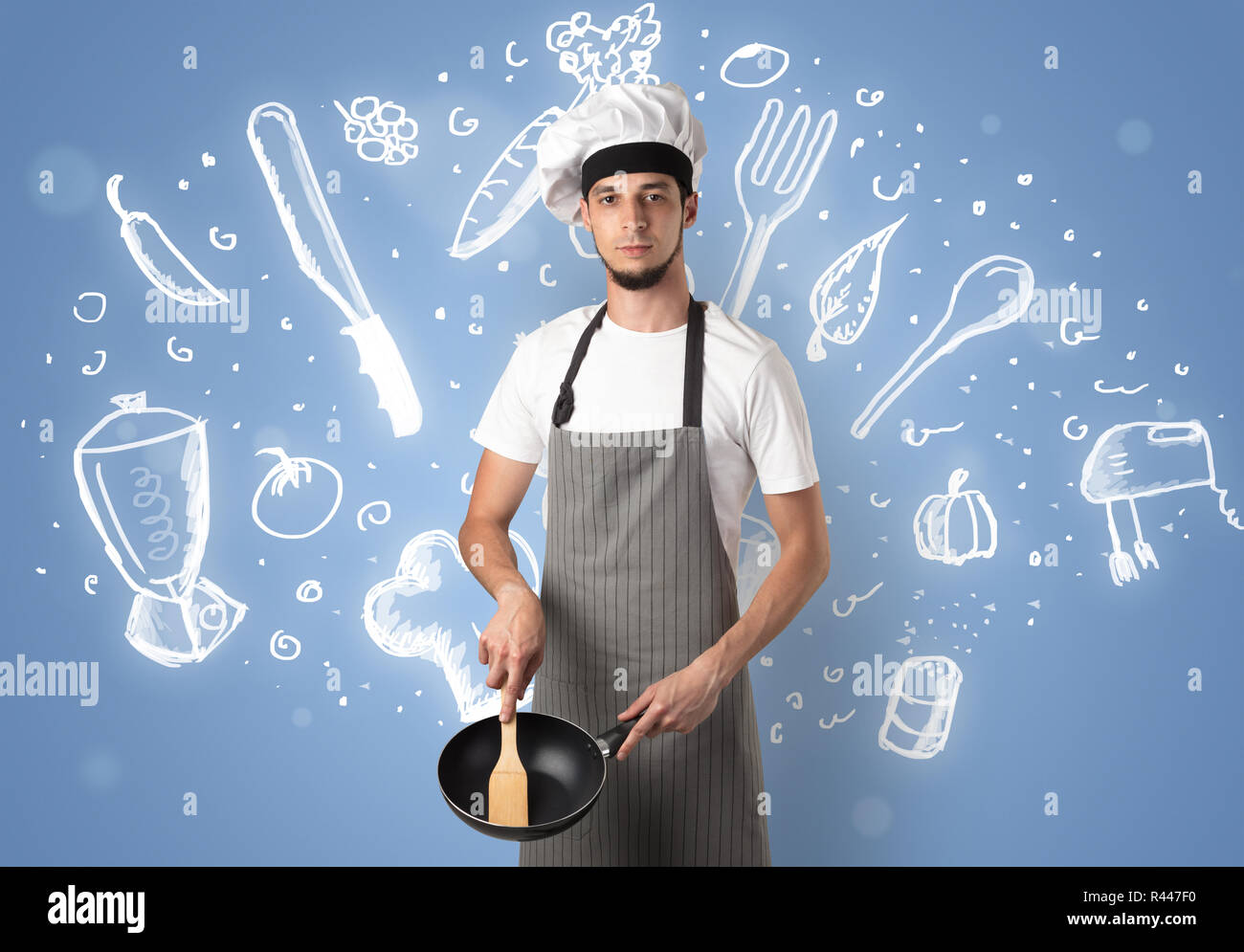 Young cook with kitchen instruments and drawn recipe concept on ...