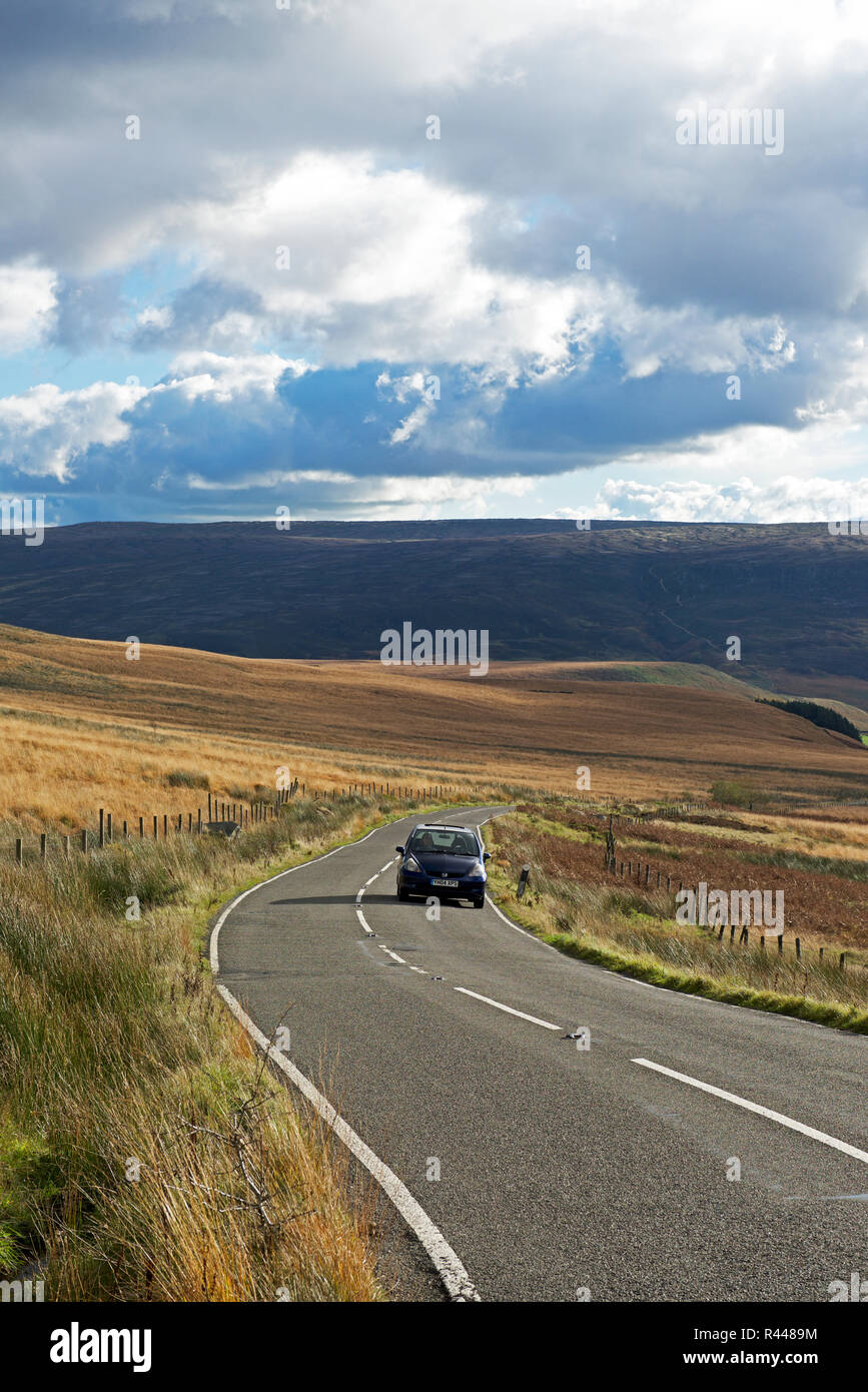 Car on road, Holme Moss, West Yorkshire, England UK Stock Photo