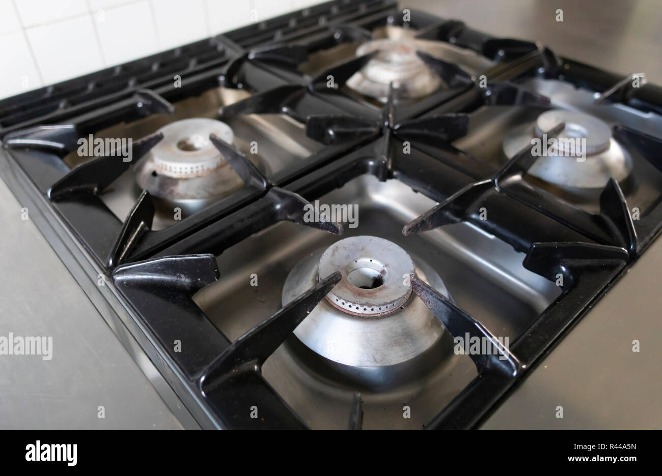 Close Up Sof A Burner Of Four On An Industrial Kitchen Gas Stove Close Up Sof A Burner Of Four On An Industrial Kitchen Gas Stove