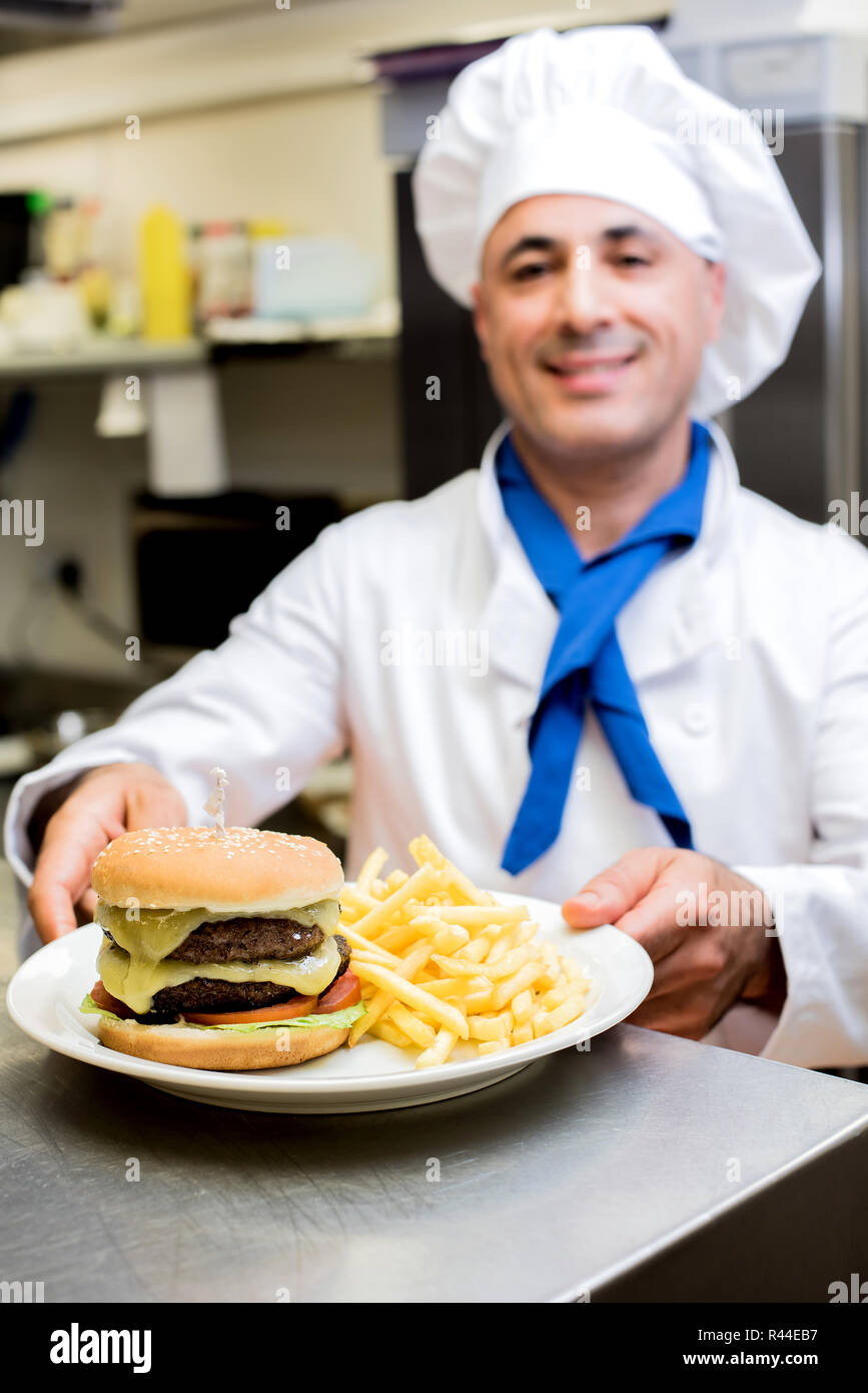 Male chef serving the order Stock Photo