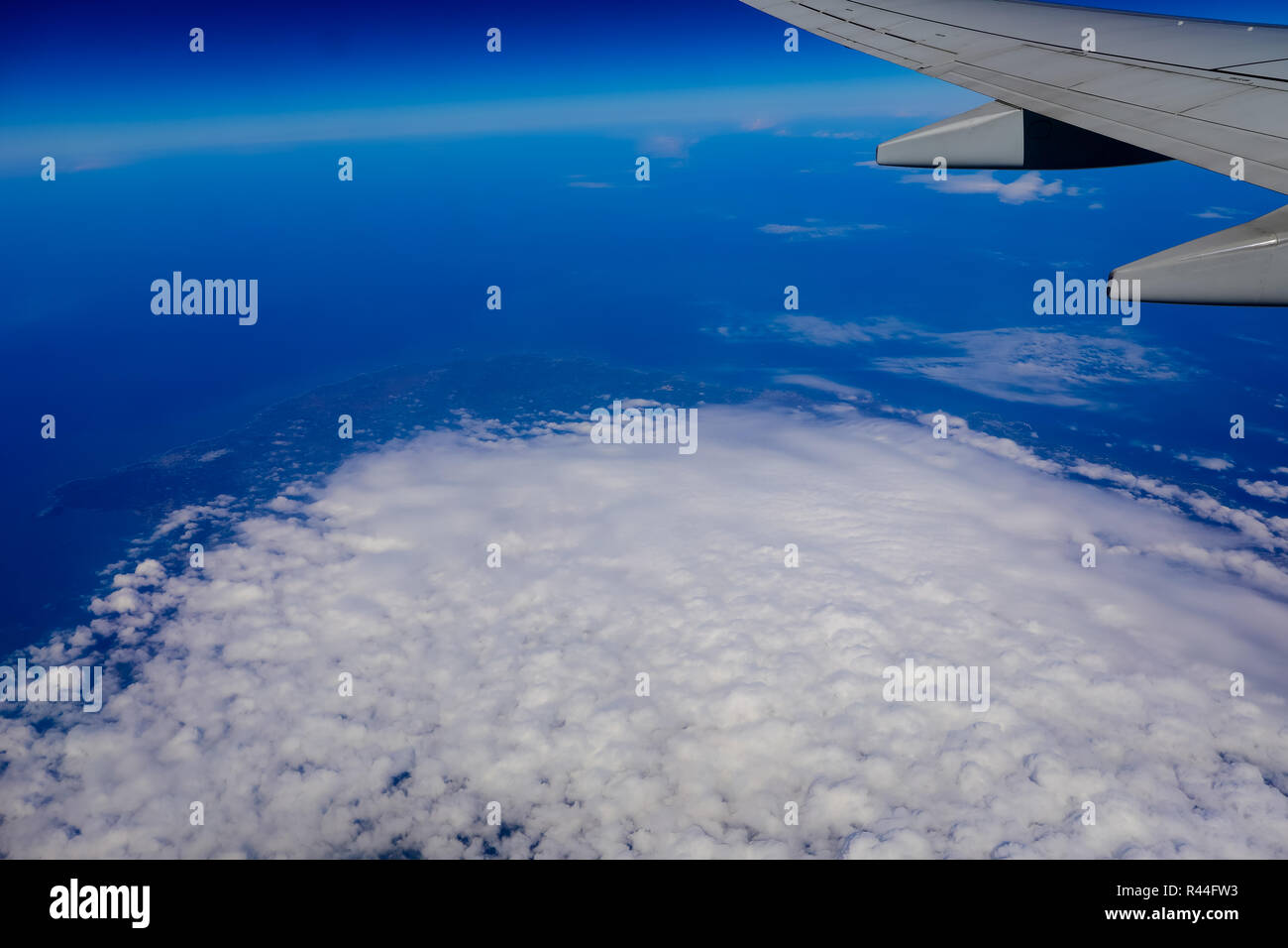 airplane wing over the blue cloud sky Stock Photo - Alamy