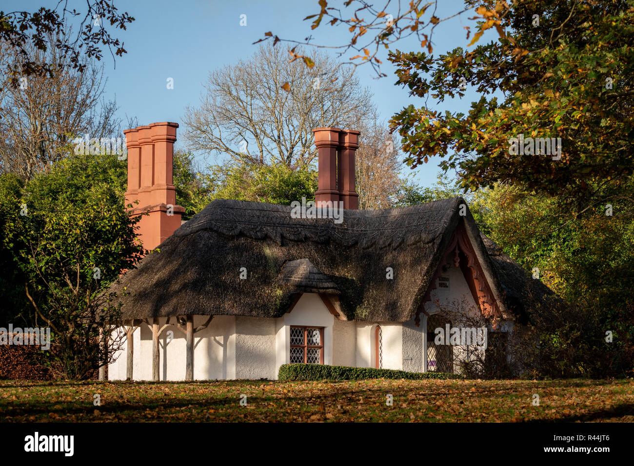 The Deenagh Lodge thatched roof Irish traditional cottage at Demesne, Killarney National Park, County Kerry, Ireland Stock Photo