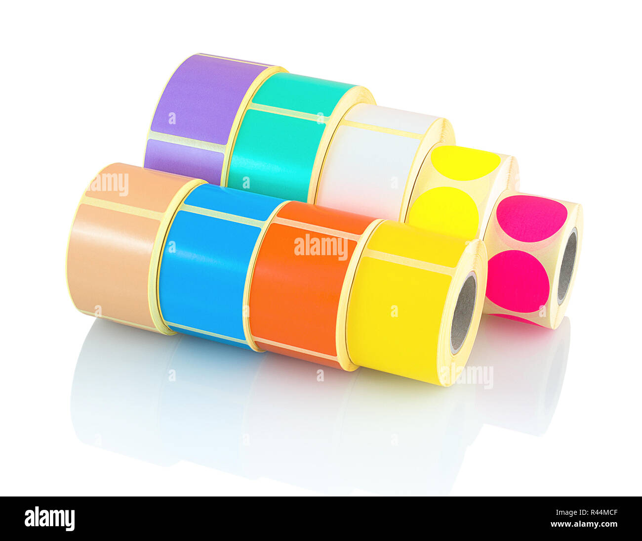 Colored label rolls isolated on white background with shadow reflection