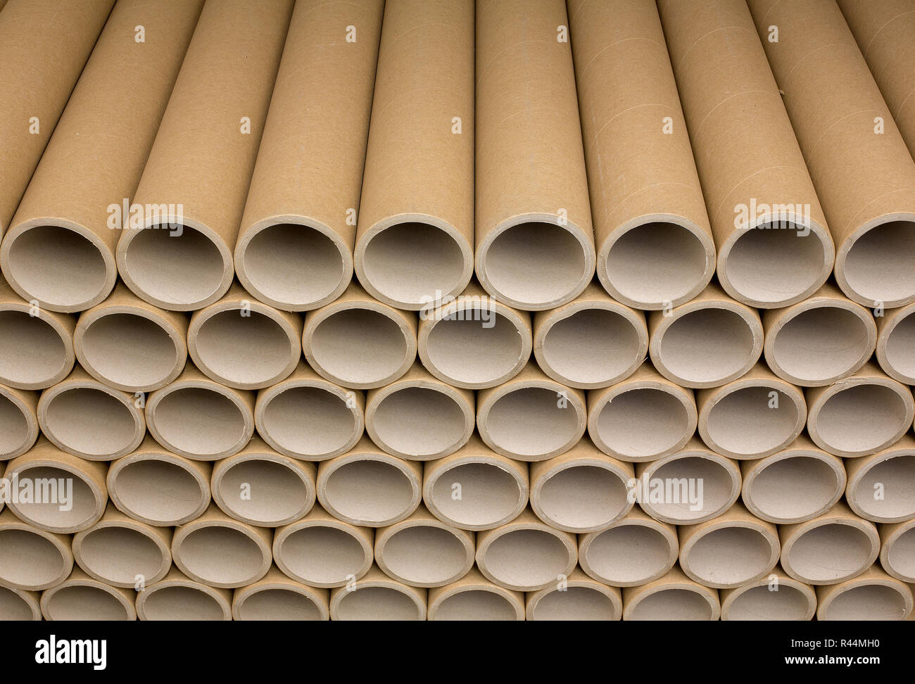 A bunch of brown industrial paper core. A lot of paper cores or paper