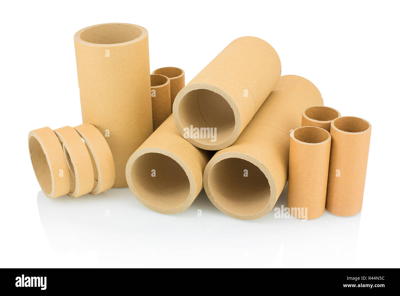 A bunch of brown industrial paper core isolated on white background with shadow reflection. A
