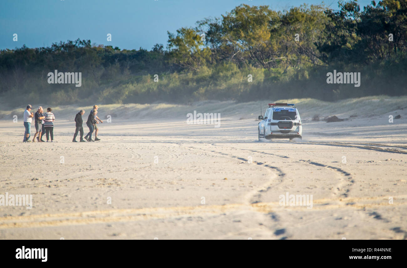 Police 4WD driving along the beach. Stock Photo