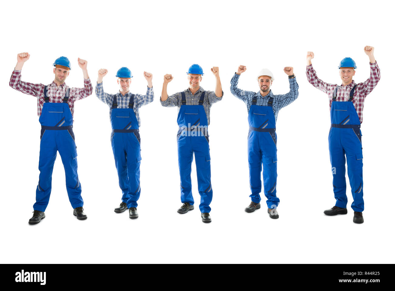 Portrait Of Successful Male Carpenters Standing In Row Stock Photo
