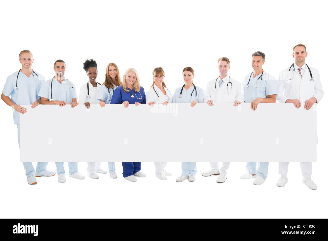Confident Multiethnic Medical Team Holding Blank Billboard Stock Photo