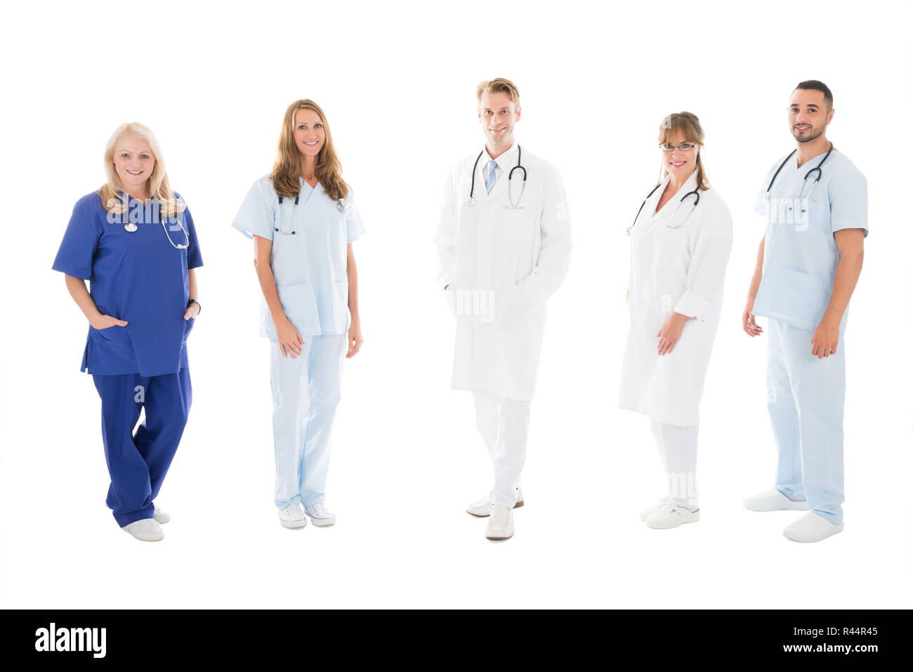 Portrait Of Confident Medical Team Standing In Row Stock Photo