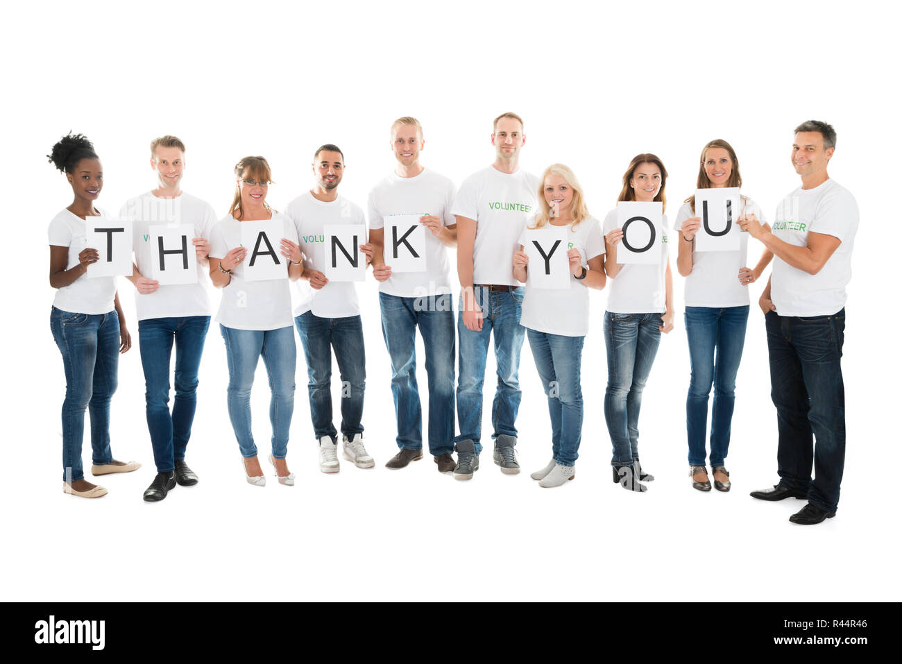 Confident Volunteers Showing Thank You Sign Stock Photo