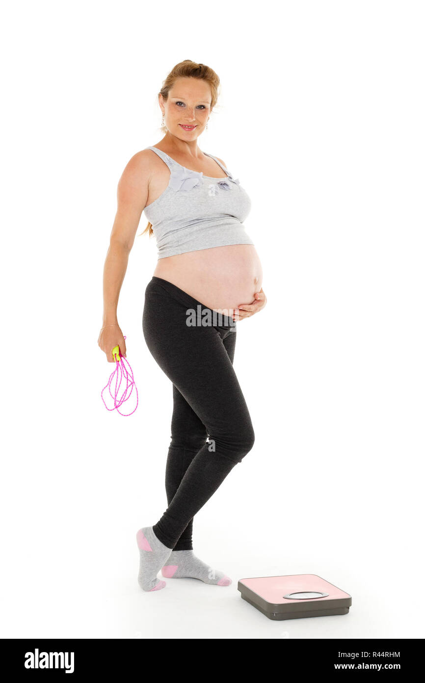 Sports pregnant woman with scales Stock Photo Alamy