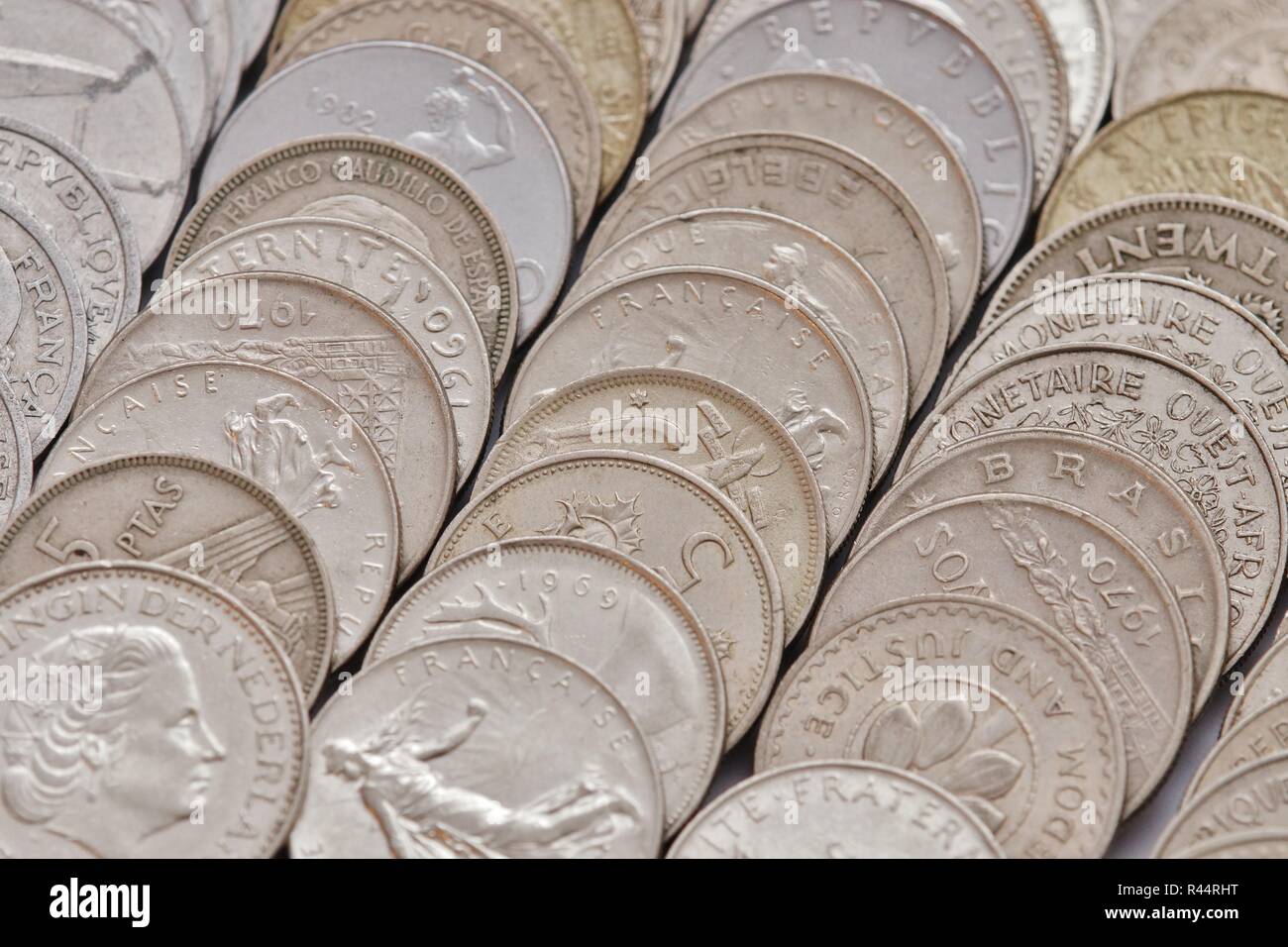 various currencies old lying on a table Stock Photo