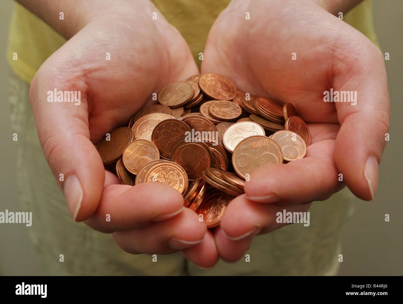 woman holding a small amount of money in their hands Stock Photo