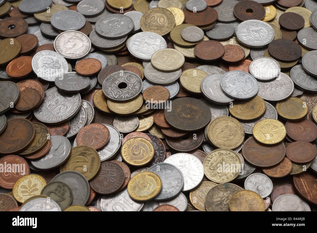 various currencies old lying on a table Stock Photo