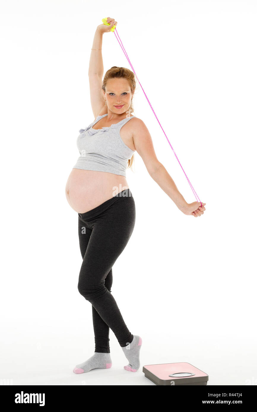 Sports pregnant woman with scales Stock Photo Alamy