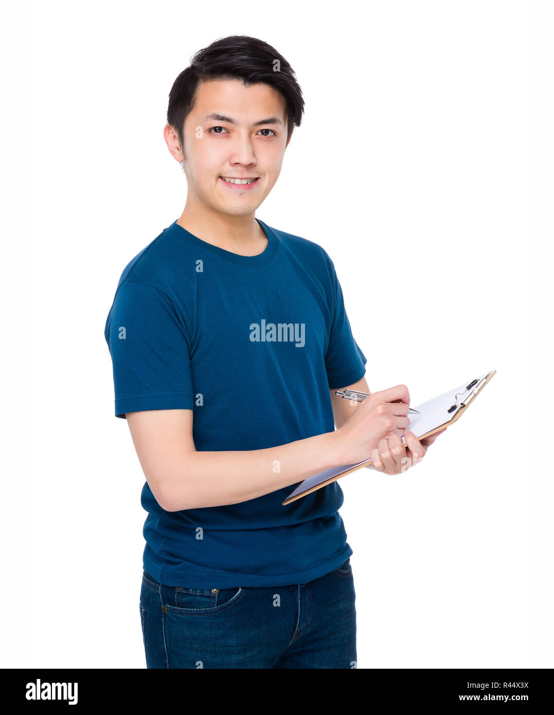 Man take note on clipboard Stock Photo - Alamy