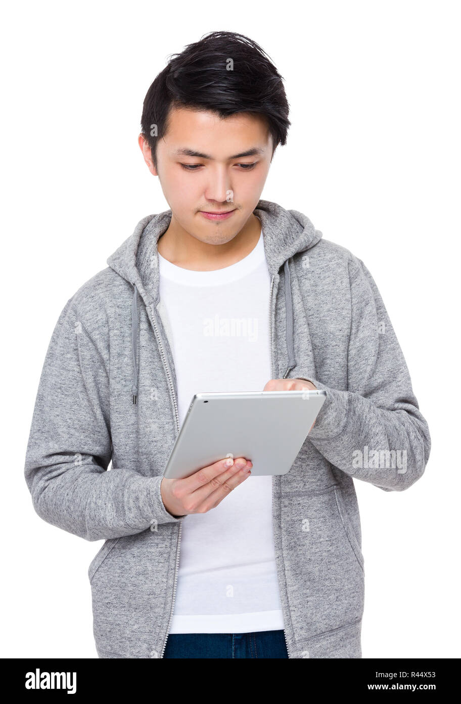 Young Man use of the tablet pc Stock Photo