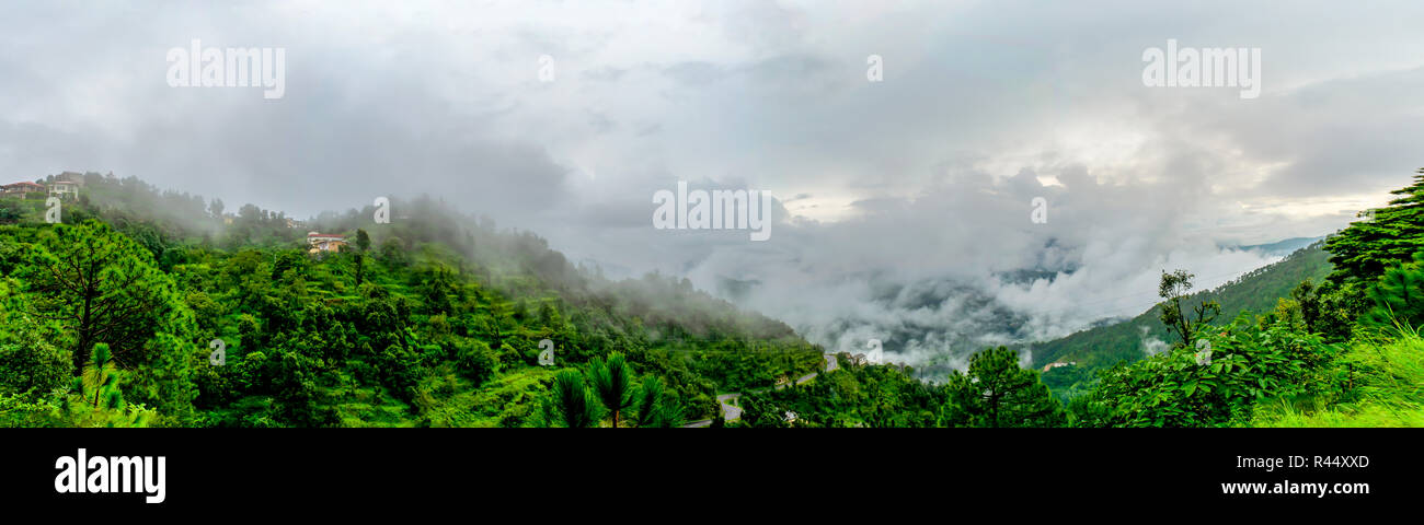clouds floating over the mountain range as seen while driving to Binsar, near Almora, Uttarakhand,. rainy season, monsoon India Stock Photo