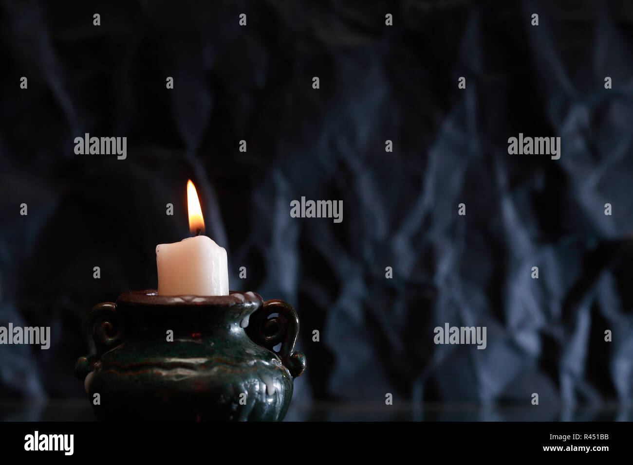 One lighting candle with reflection against dark background Stock Photo ...