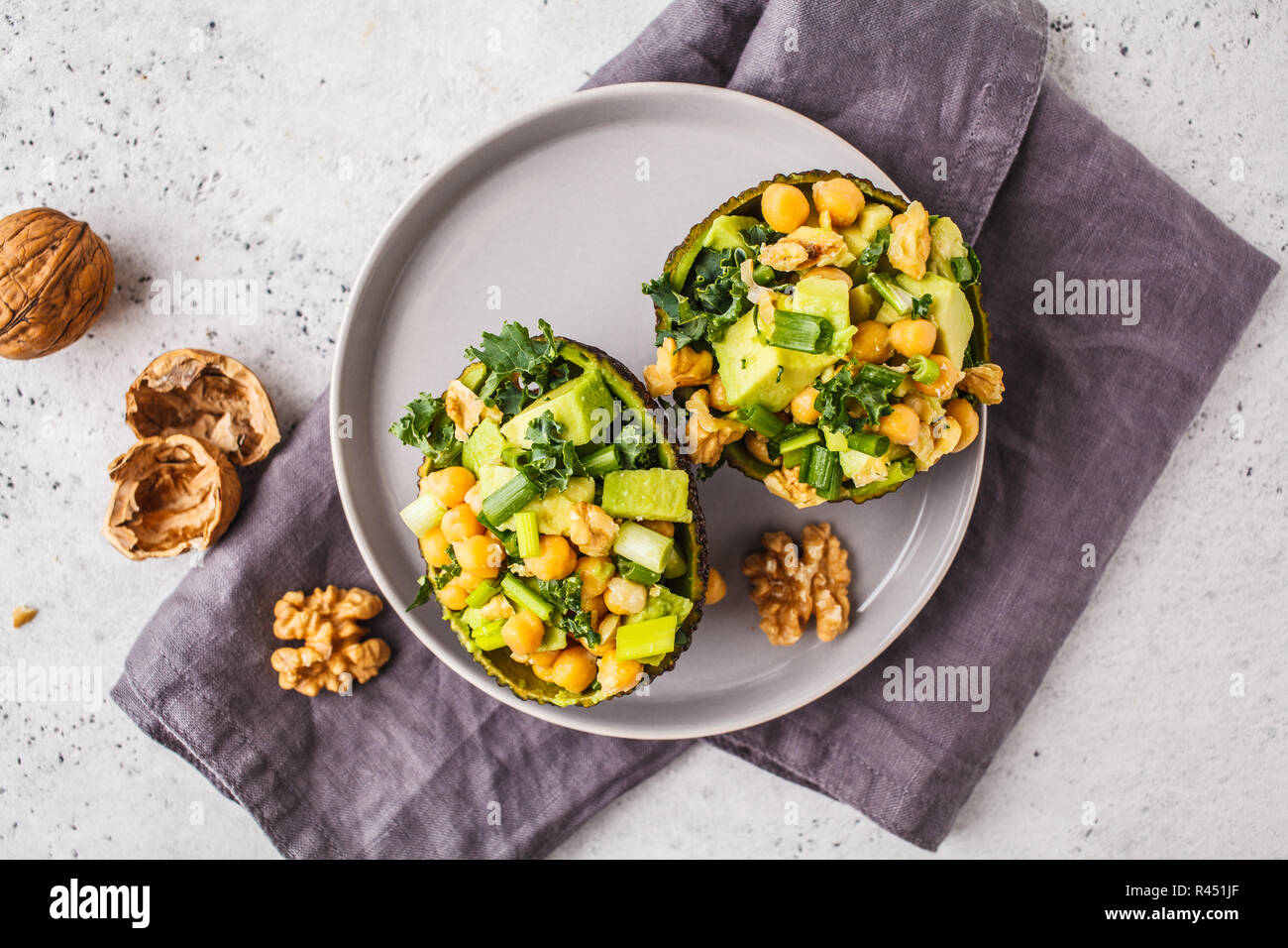 Avocado Halves Stuffed With Avocado Nuts And Chickpeas