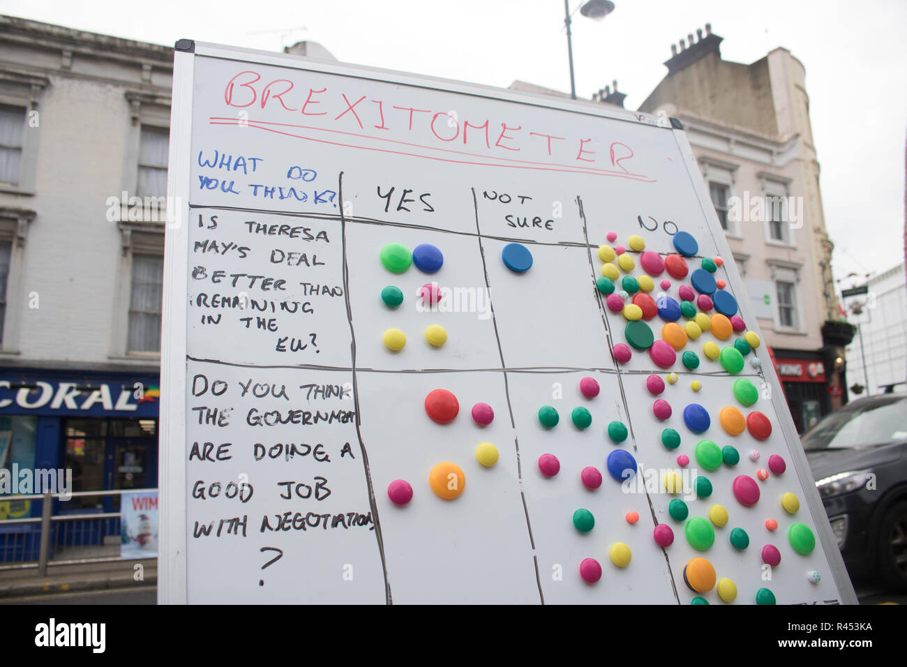 Wimbledon London ,UK 25th November 2018. Members of the public are invited to give their response on a Brexitometer  board sponsored by the Liberal Democrat party in Wimbledon Town Centre regarding Prime Minister Theresa May's Brexit deal and whether to have a People's Vote and second referendum. PM Theresa May has written directly to appeal to the British public to  try and sell her Brexit Withdrawal Agreement which was endorsed by the 27 members of the European Union in Brussels today Credit: amer ghazzal/Alamy Live News Stock Photo
