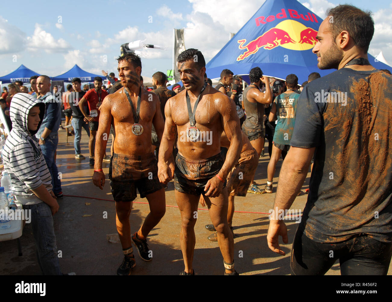 Byblos, Lebanon. 25th Nov, 2018. Participants celebrate with their medal  after finishing the 5th Puma Hannibal Race, 6-kilometer obstacle race that  includes more than 800 participants from several countries and organized by
