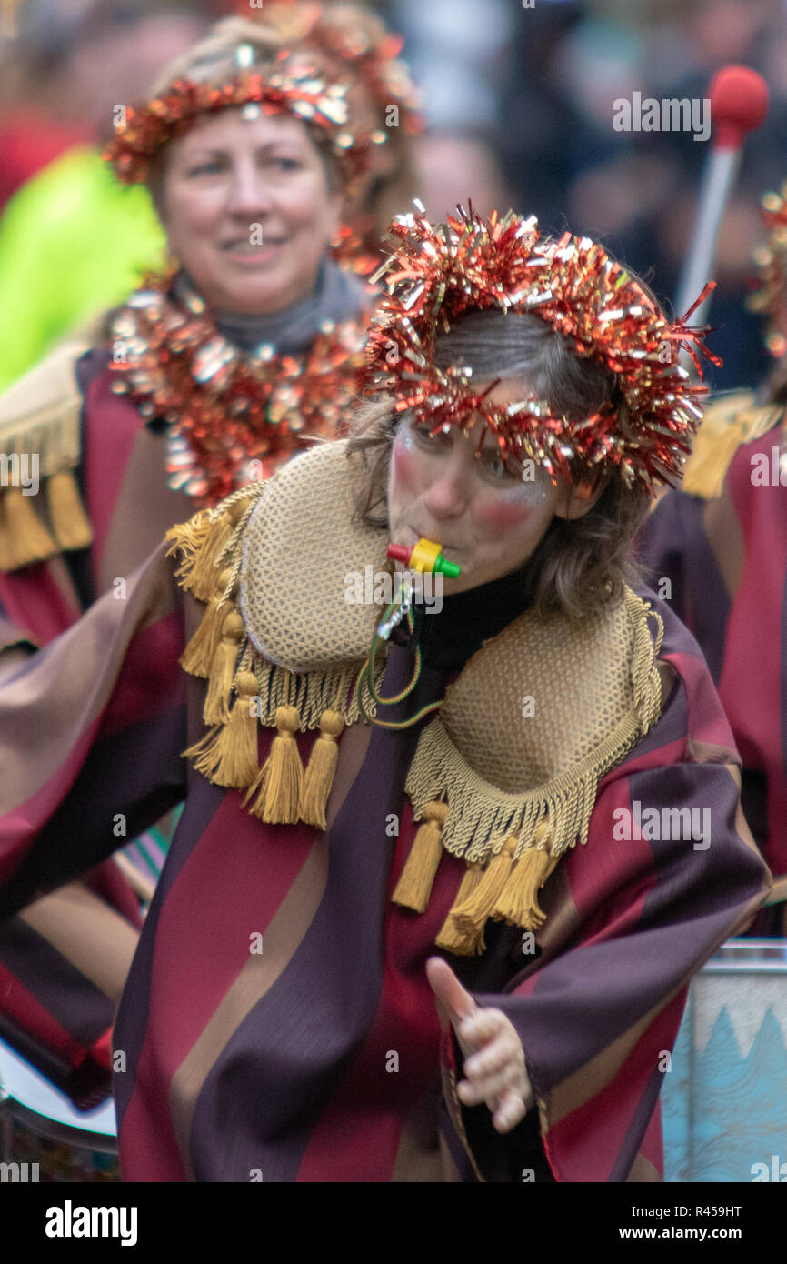 Glasgow, Scotland, UK. 25th November, 2018. The annual Style Mile Carnival has paraded through Glasgow city centre from St. Enoch Square to George Square, where the Christmas market was opened this afternoon. Watched by thousands of locals and tourists, hundreds of festive performers in dazzling costumes took to the streets of Scotland's largest city. The procession was led by Lord Provost Eva Bolander, along with 8-year-old Caleb Miller, who is raising funds for Glasgow Children's Hospital Charity. Iain McGuinness / Alamy Live News Stock Photo