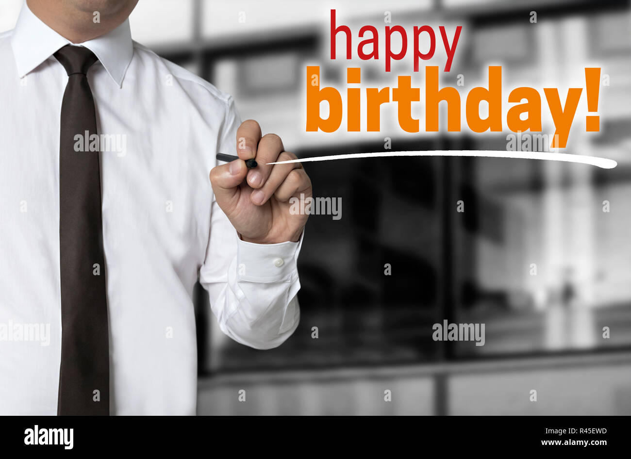 happy birthday is written by businessman background concept. Stock Photo