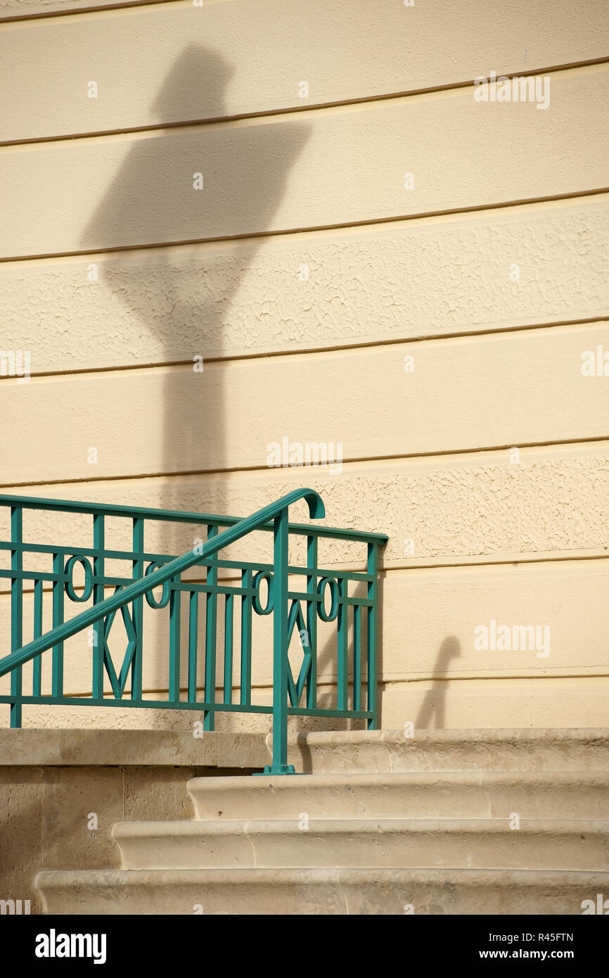 stair railing with lantern shadow Stock Photo