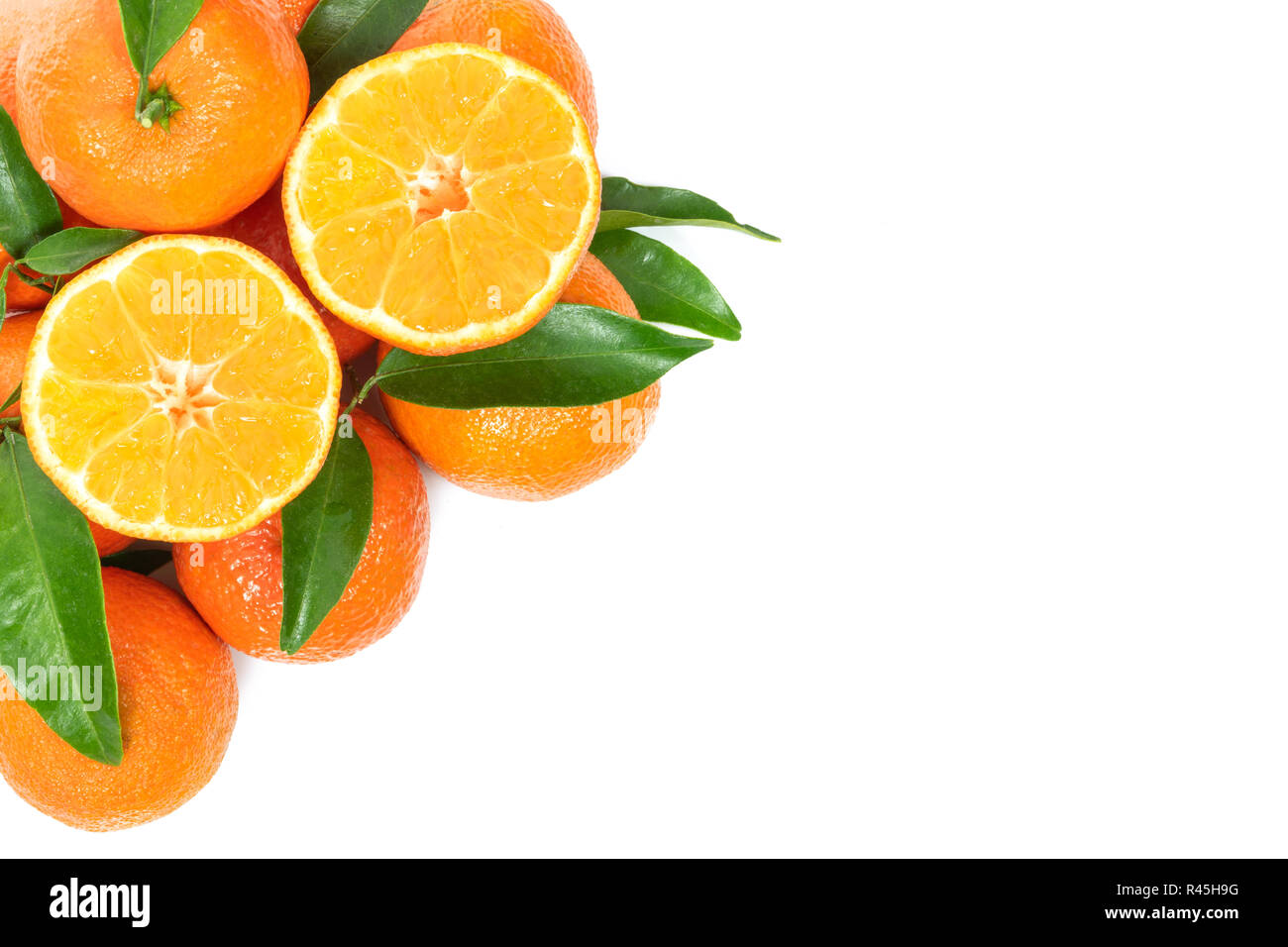 Tropical fruit composition - group of fresh oranges or tangerines  isolated on a white background with copy space Stock Photo