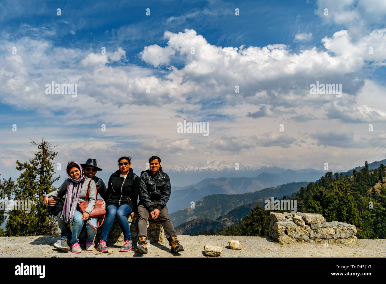 friends are forever, posing, Jot, with the Manimahesh Kailash in the background Stock Photo