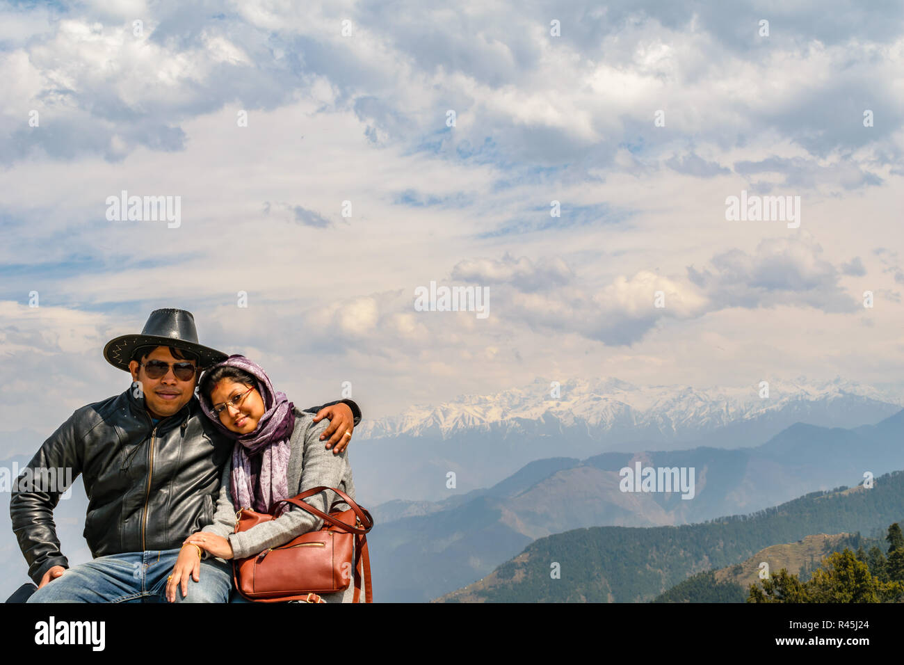 friends are forever, posing, Jot, with the Manimahesh Kailash in the background Stock Photo