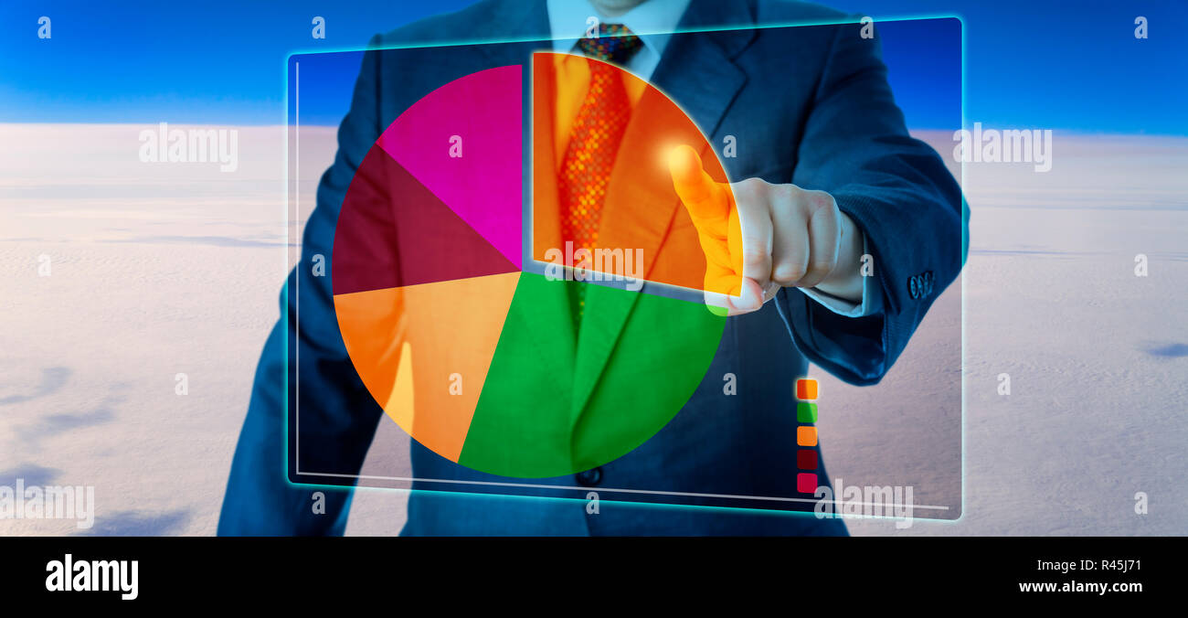 Manager Segmenting A Pie Chart High Above The Sky Stock Photo