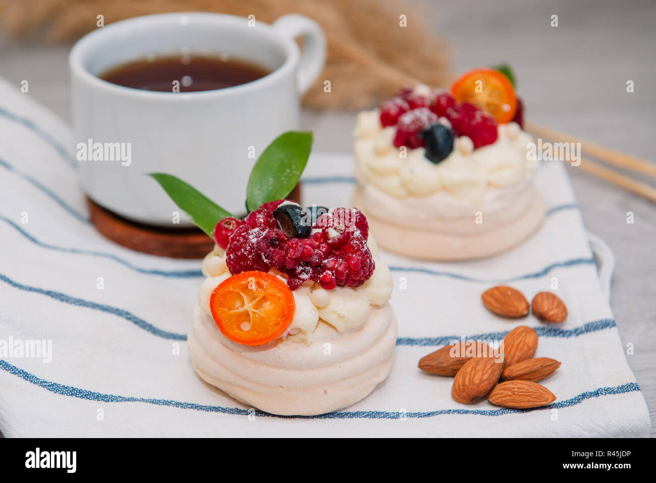 Pavlova meringue cake with cream and small fruits Stock Photo Alamy