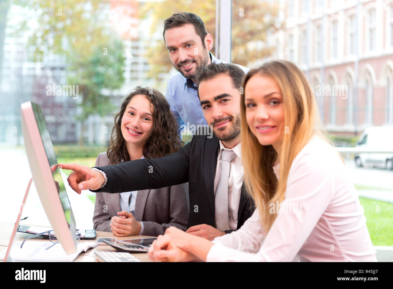Group of business people working together at the office Stock Photo - Alamy